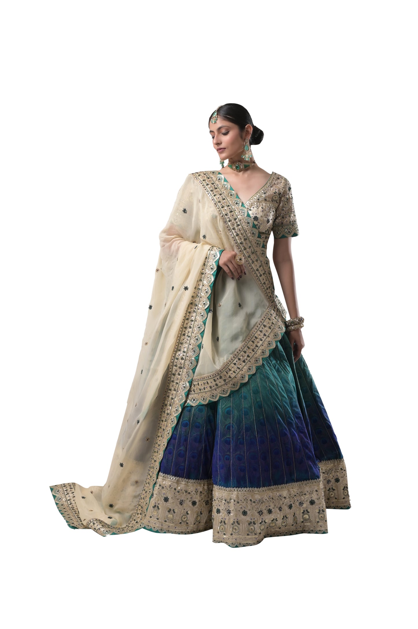 PEACOCK ELEGANCE: HANDCRAFTED SILK LEHENGA WITH REAL PEACOCK FEATHERS