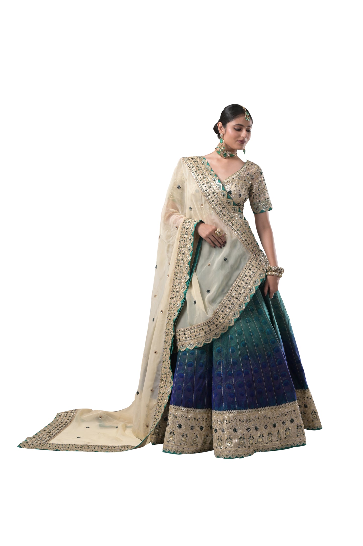 PEACOCK ELEGANCE: HANDCRAFTED SILK LEHENGA WITH REAL PEACOCK FEATHERS