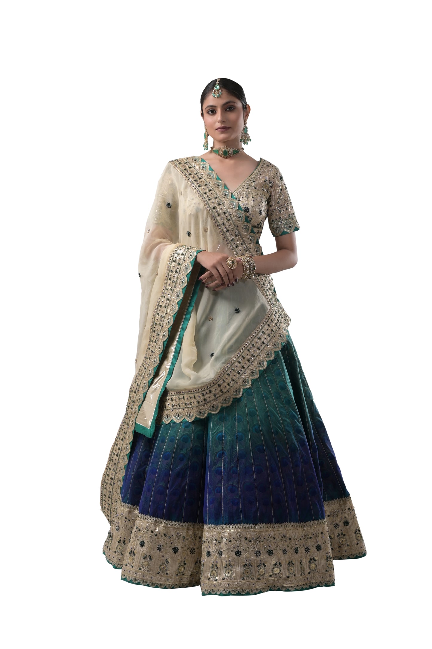 PEACOCK ELEGANCE: HANDCRAFTED SILK LEHENGA WITH REAL PEACOCK FEATHERS