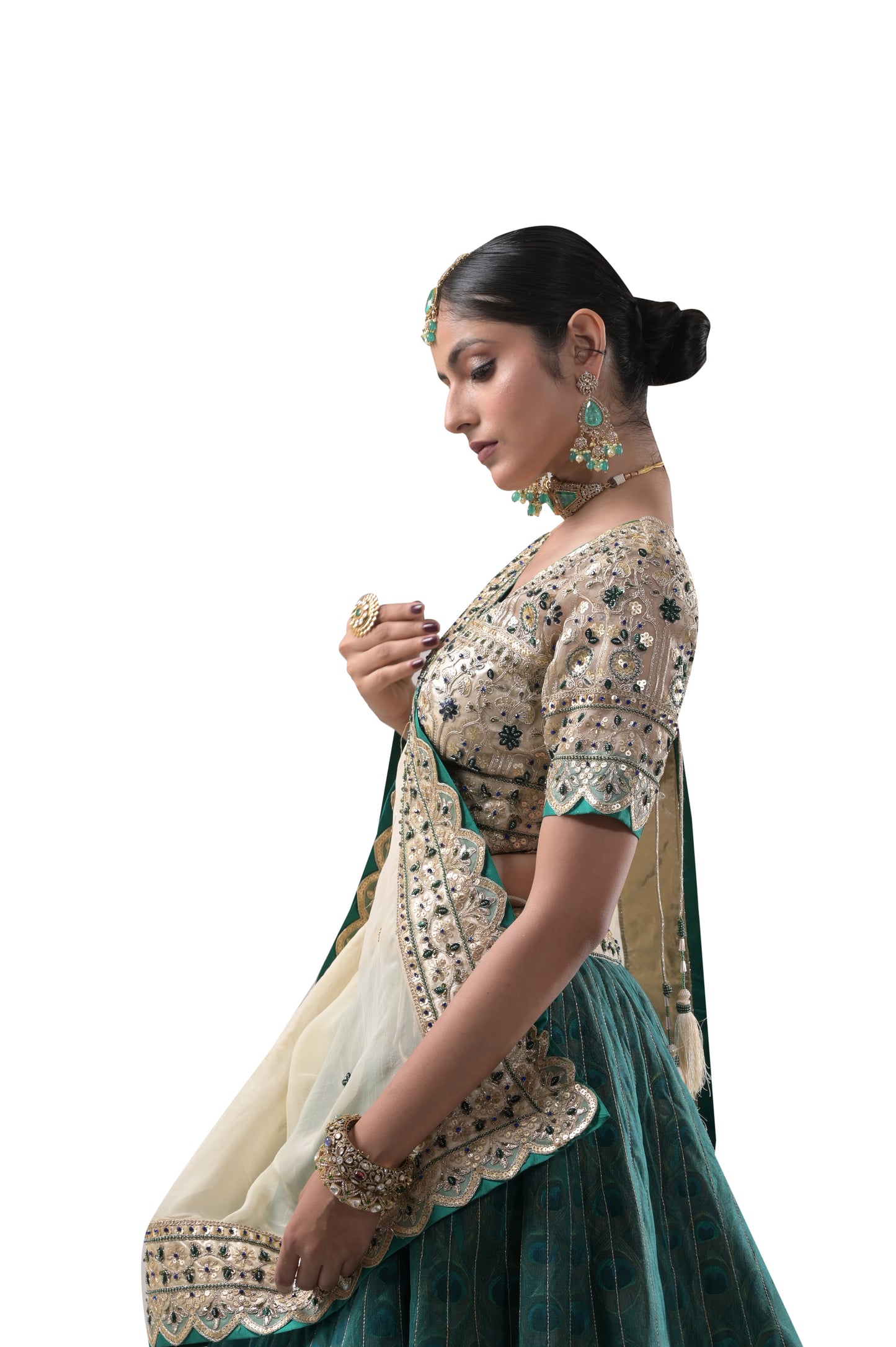 PEACOCK ELEGANCE: HANDCRAFTED SILK LEHENGA WITH REAL PEACOCK FEATHERS