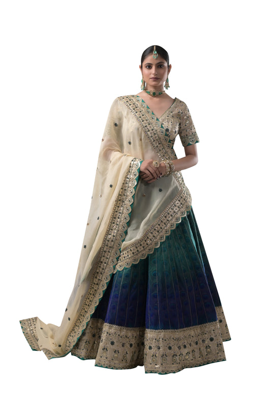 PEACOCK ELEGANCE: HANDCRAFTED SILK LEHENGA WITH REAL PEACOCK FEATHERS