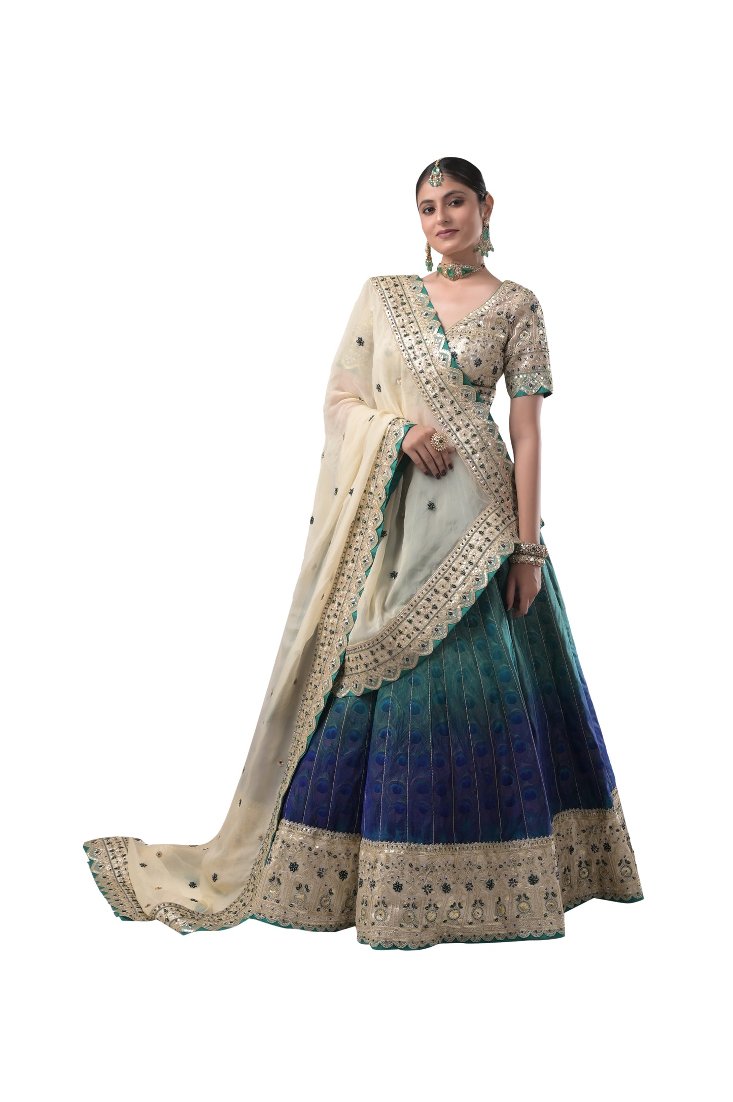 PEACOCK ELEGANCE: HANDCRAFTED SILK LEHENGA WITH REAL PEACOCK FEATHERS