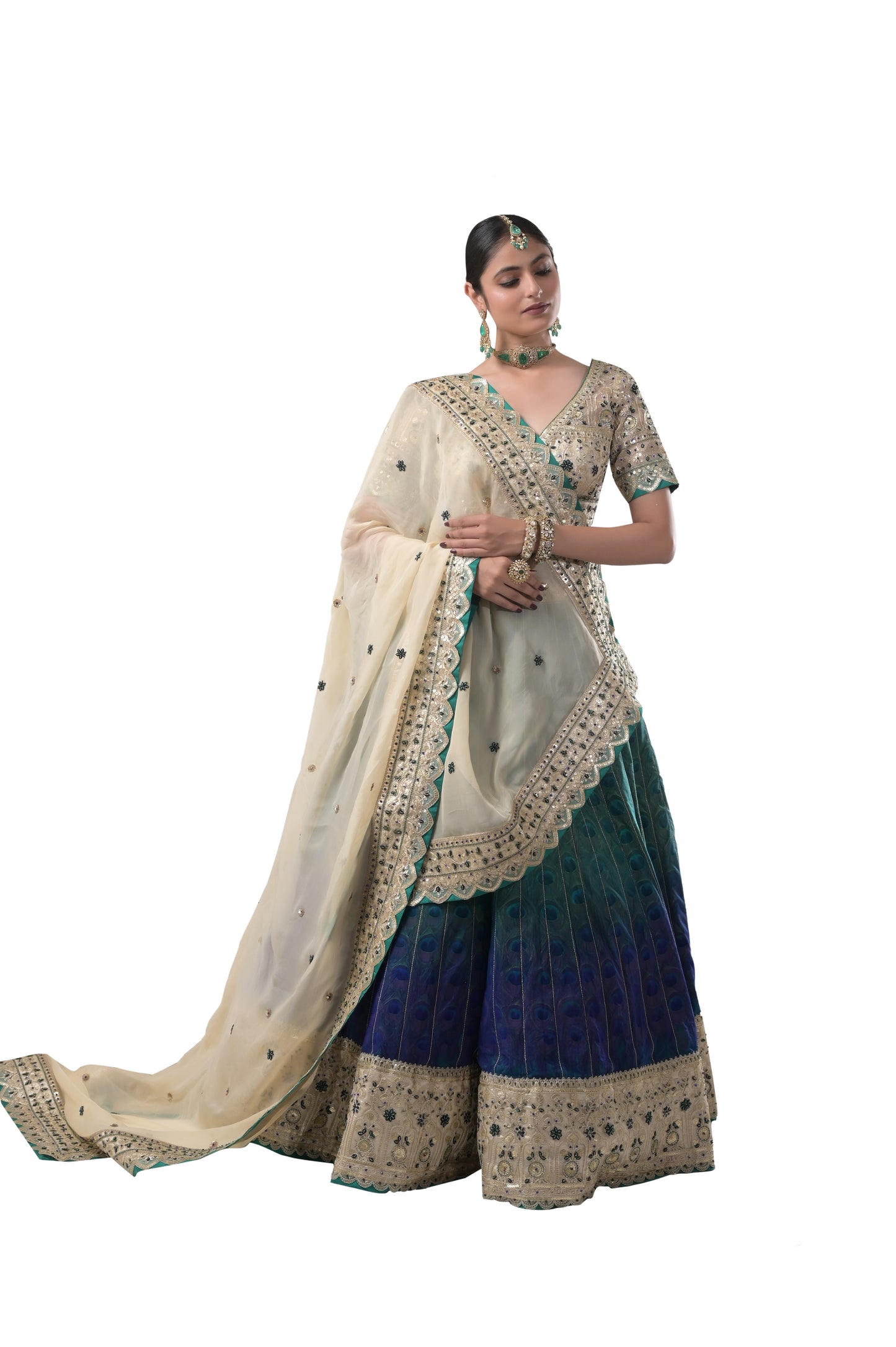 PEACOCK ELEGANCE: HANDCRAFTED SILK LEHENGA WITH REAL PEACOCK FEATHERS