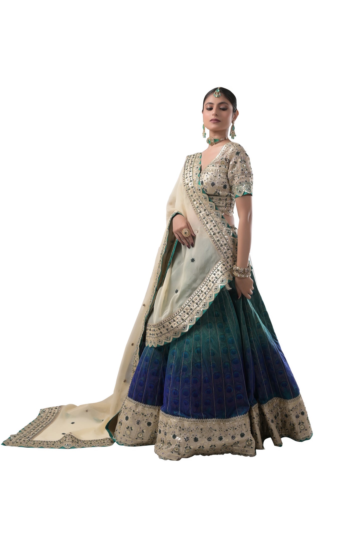 PEACOCK ELEGANCE: HANDCRAFTED SILK LEHENGA WITH REAL PEACOCK FEATHERS