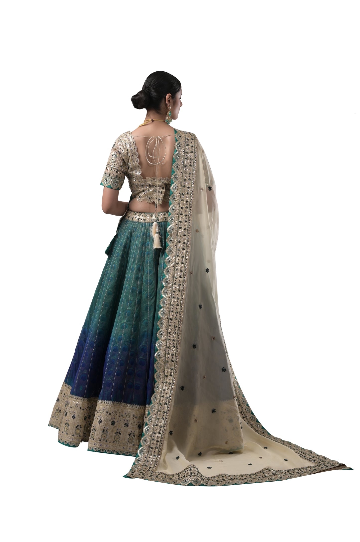 PEACOCK ELEGANCE: HANDCRAFTED SILK LEHENGA WITH REAL PEACOCK FEATHERS